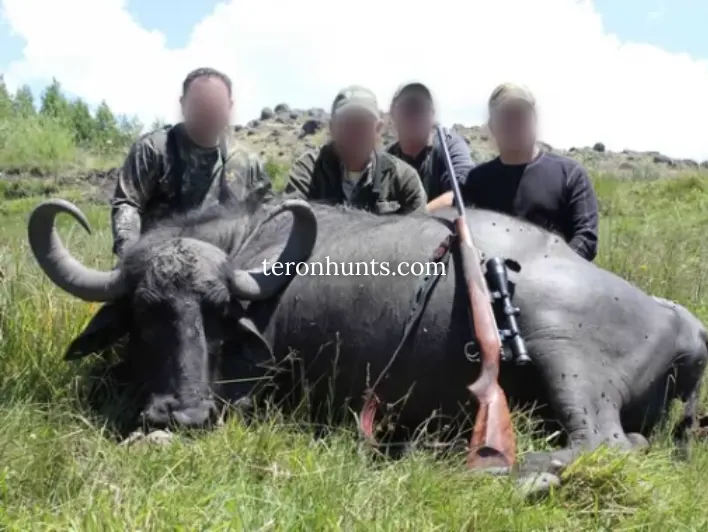 Hunter taking picture with his hunted asian water buffalo in Argentina, example of successful client of Teron who went asian water buffalo hunting in Argentina
